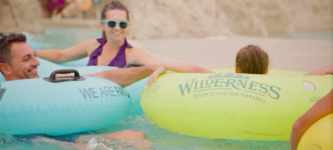 Family floating the lazy river at the Wilderness