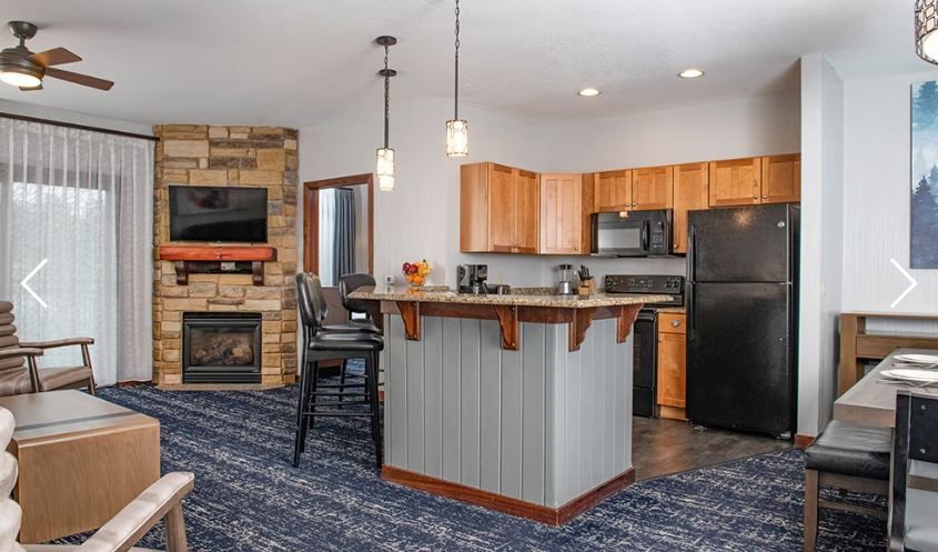 Three bedroom deluxe living room with fireplace
